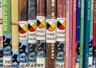 Picture book spines with a medicine wheel label sticker.